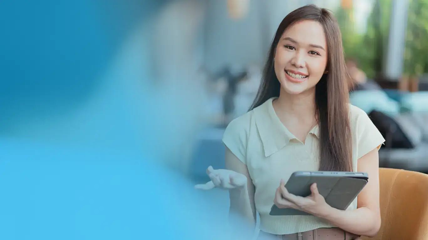 A smiling young woman holding a tablet, engaging in a conversation, representing Smart Recruitment & Application Tracking. The image highlights seamless digital hiring solutions, efficient candidate management, and modern recruitment strategies.
